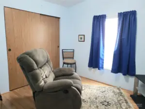 Another Picture of the Good Size Third Bedroom with Laminate Flooring and Large Closet.