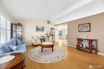Front formal living area opens to the kitchen/dining area through the vaulted ceilings- making this floorplan feel open & bright.