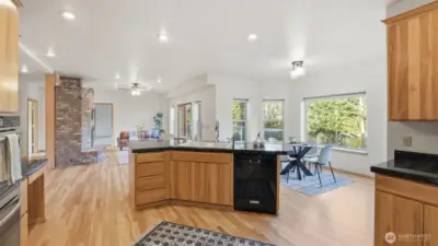 Enjoy cooking with a view — large windows bring in natural light throughout the kitchen and dining area.