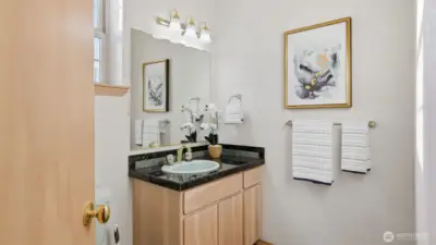 A bright and functional ensuite bath designed for the secondary primary or guest retreat.