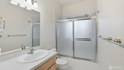 Well-appointed upper-level guest bath with a clean, functional layout and full shower/tub combo
