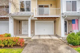 Close up front door and garage