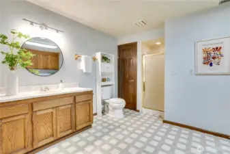 Downstairs 3/4 bathroom and laundry has extra space for storage, crafts, and projects.