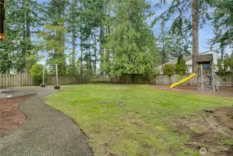Frolic and play in this expansive fenced yard with aggregate patio, play set and plenty of room for fido or your fire pit conversation area.