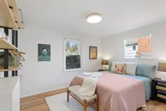 Primary bedroom with custom shelving and custom soft close closet door