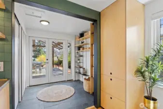 Detail shot of french doors leading to covered deck and backyard