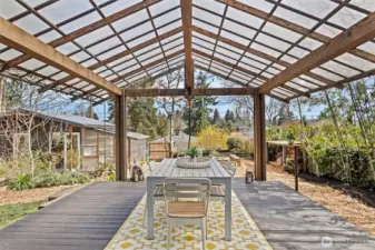 Welcome to your impressive covered deck leading you to this private and serene garden oasis