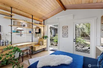 Studio space is light filled, has custom shelving and radiant floor heat