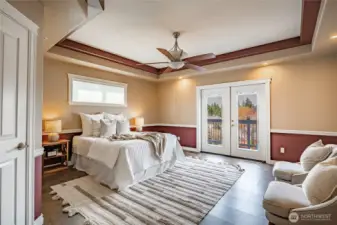 Primary Bedroom and Ensuite - features coffered ceilings and French doors that lead to the deck.