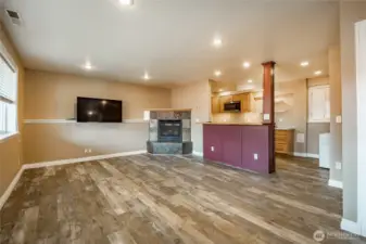 Lower level - Family room with gas FP and open to Kitchen