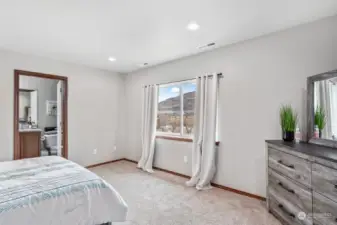 Large primary bedroom. Views of mountains, lake, golf course.