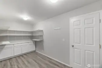 Wow! What a pantry. This alone is a reason to buy this house! Door leads to garage and there is plenty of space here for a mudroom.