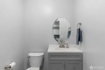 Convenient main floor powder room with newer vanity and toilet