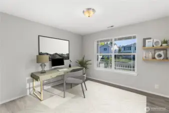 Not only does this home feature four bedrooms PLUS a bonus room....it also has a main floor office!  Virtually staged home office gets great light, and has views to the front of the home