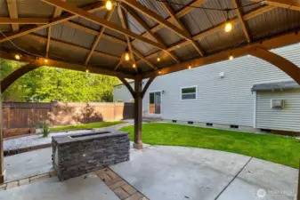 Nice covered outdoor space for year 'round enjoyment. It is already strung with party lights for your first spring BBQ