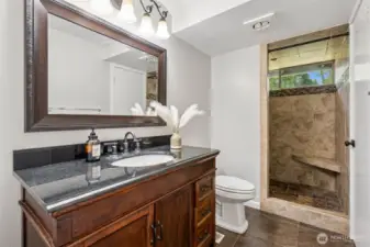 fully updated bath with tile suround.