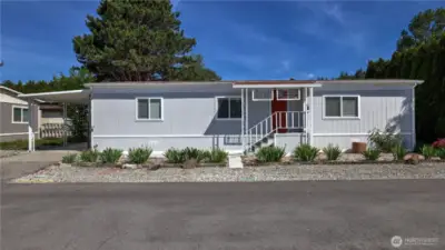 Welcome to Walnut Grove! This darling 55+ community is situated in the heart of Kent just minutes to local shops, dining, major freeways, Green River & other local amenities. Enjoy peace of mind in this home w/newer vapor barrier, exterior paint, & modern laminate flooring throughout the main living spaces. The living room offers ample configuration opportunities w/an open concept layout flowing into the kitchen & dining room seamlessly. Kitchen features white cabinets, breakfast bar seating, open sight lines to the living room, plus both formal & informal dining space. Retreat to the large primary w/a 3/4 bath en suite, plus spacious 2nd bedroom w/an additional 3/4 guest bath. Buyer subject to park approval, cats/dogs ok w/approval.