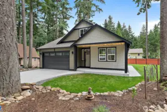 Poured Private Walkway Leads to the Fenced Backyard! Covered Front Porch with Knotty Pine Soffit! Stone Terracing Frames this Large Cul-de-Sac Parcel!