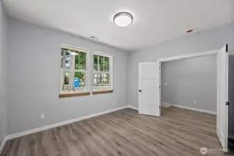 An Interior View of the Main Floor Flex Room. Dual Entry Doors - Ideal Guest Bdrm or Home Office!