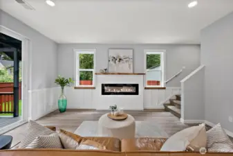 Linear Fireplace Centers the Great Rm. The Live Edge Mantel Adds to the Quality of this Meticulously Built Home!