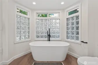 Updated main floor guest bath with beautiful, stand alone soaking tub!