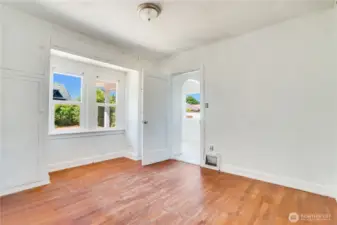 Bedroom #2 opens into the rear entry/kitchen space