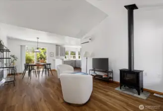 Sunlight floods this airy, open-concept living room, where clean lines and fresh tones create a serene, welcoming space