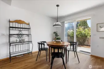 Dining area, seamlessly integrated into an open living space and filled with natural light for a calm, minimal aesthetic.