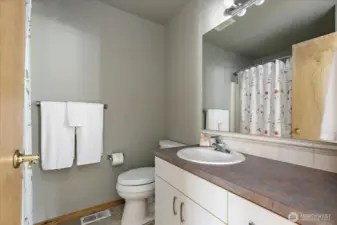 Guest bath conveniently located close to living area.