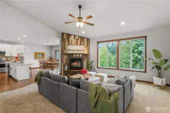 Expansive living space with soaring ceilings, yet cozy with gas fireplace.
