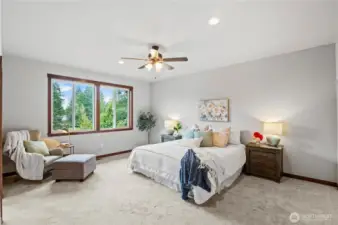 Dramatic Master Bedroom with sweeping views of Lost Lake.