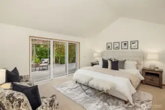 Spacious primary suite with sliding door to private deck