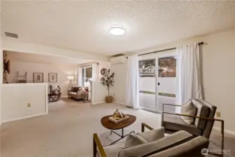 Second living area off kitchen/living room with deck access.