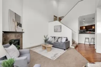 Spacious living area with large windows and room to relax or entertain.