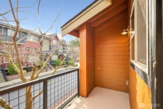 Private balcony offering fresh air and neighborhood views.