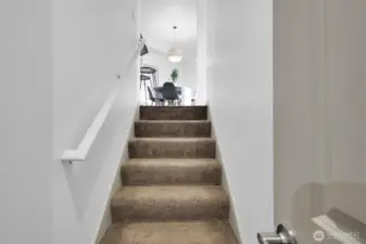 Staircase connects the home’s levels with a bright, open feel.