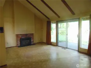 Vaulted Ceilings in the open off Kitchen Great Room , Slider leads to back patio.