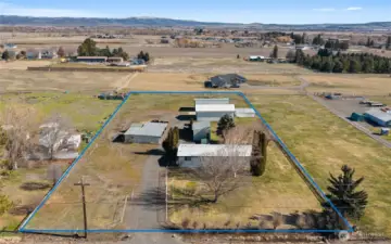 2 irrigated acres with a home, shop and many other outbuildings!