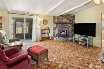 Family room with sliding glass door to the back deck