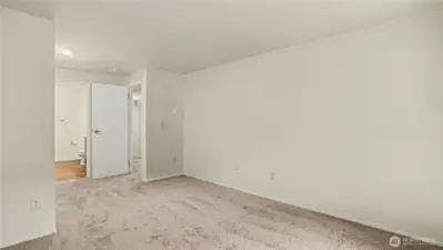 Another angle of your Primary Suite showcasing the abundance of natural light that beams into this space.