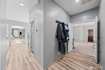Hallway to front of house and hall to Primary bed room
