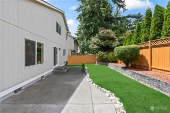 Well manicured, low maintenance backyard with large patio for outdoor entertainment.