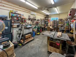 Attached to the garage this shop is sure to please complete with mini split for heat/cooling.