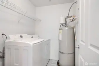 Laundry room with full size washer and dryer.
