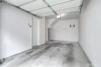 Attached one car garage with space for storage.