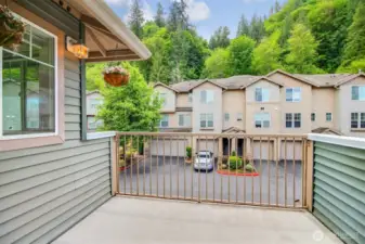 Peaceful private deck overlooks greenbelt.