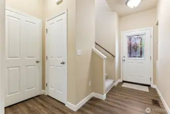 Lots of storage with coat closet and under stairs closet.