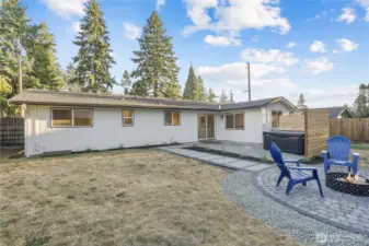 Fantastic entertainers yard with pavered fire pit