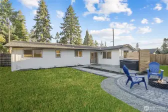 Fantastic entertainers yard with pavered fire pit