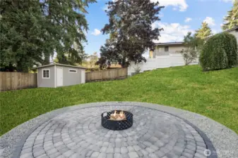 large pavered firepit area for laughs and memories